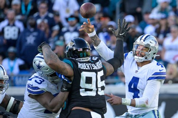 Cowboys fumble control of playoff fate in OT loss