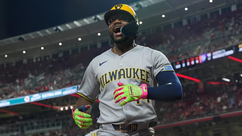 Brewers set franchise record with 14th straight win after crucial Reds error leads to extra innings