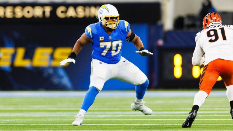 Chargers star LT Rashawn Slater carted off with apparent leg injury at practice