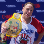 Joey Chestnut will compete in 2026 Nathan’s Hot Dog Eating Contest while under probation for battery charge