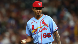 Cardinals, Rockies players tilt hats in protest after umpire's 'power-hungry move' against rookie pitcher